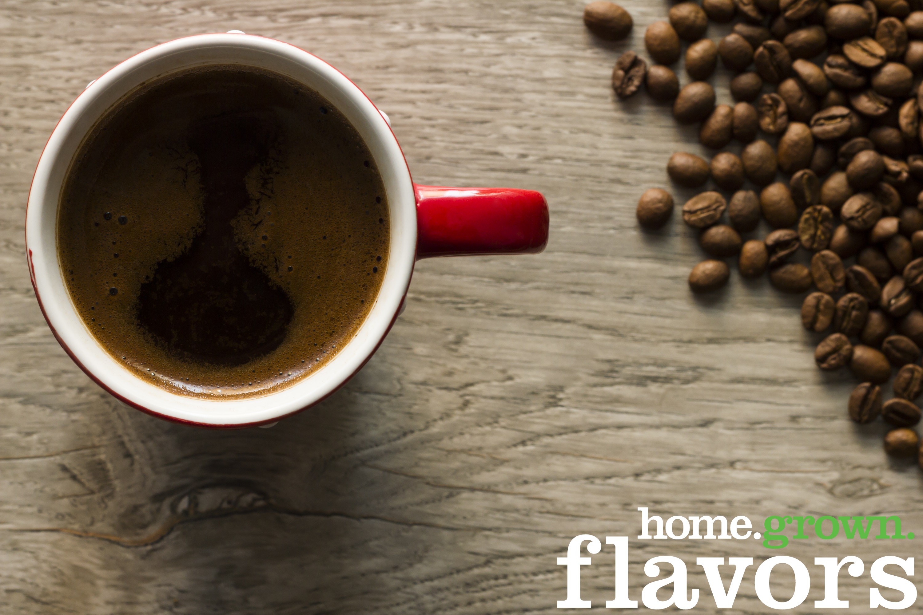 Cup of coffee and coffee beans viewed from directly above