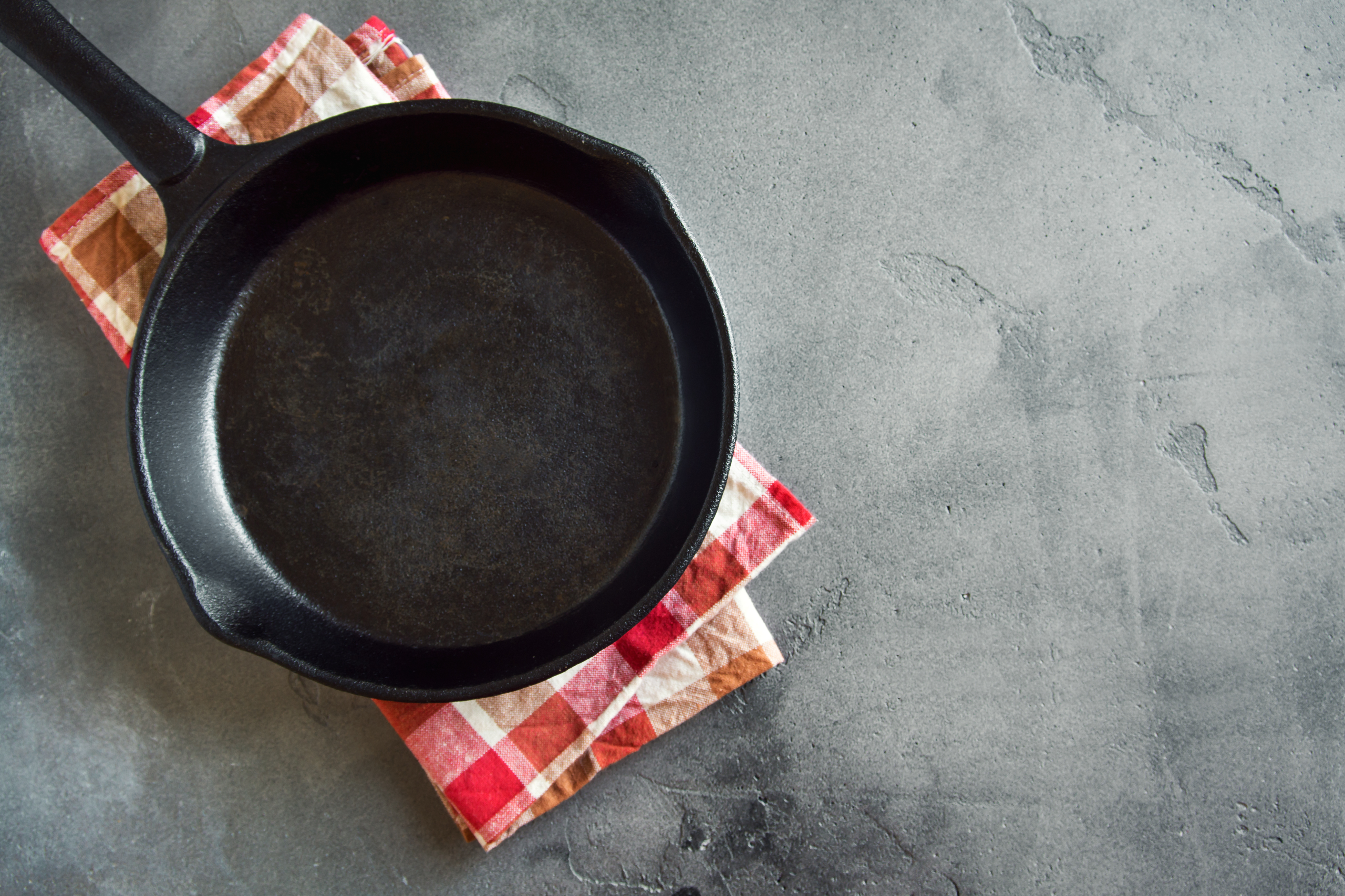 Cast iron pan on black background